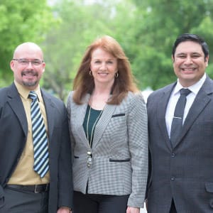 three faculty smiling