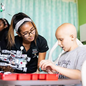 student with child in hospital