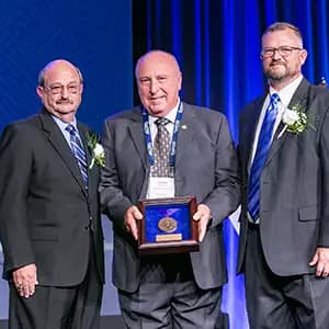 Doug Muldoon receiving his award