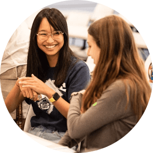 Two female students conversing